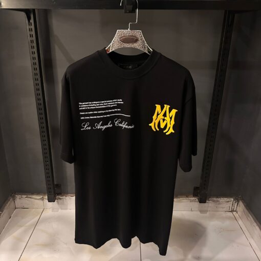 AMIRI BLACK TSHIRT YELLOW BADGE PRINT